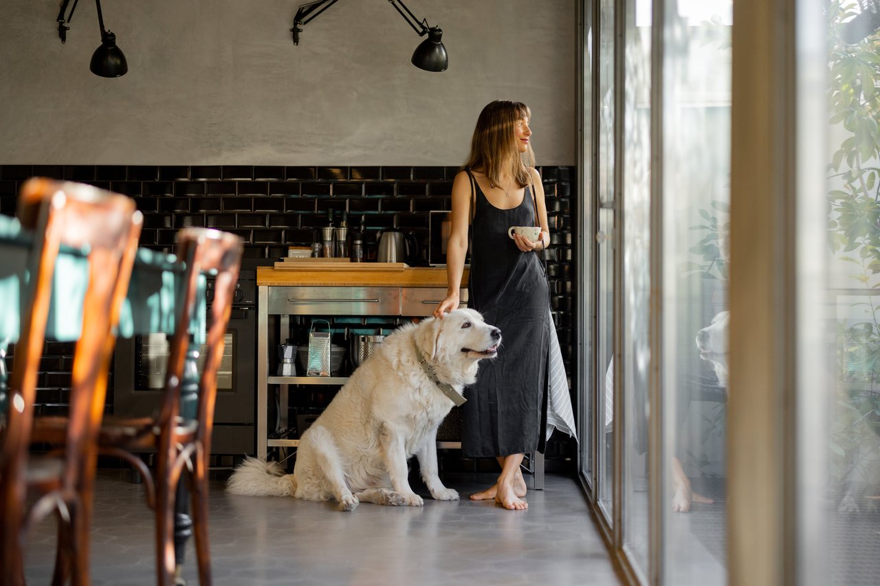Woman with her emotional support dog at home
