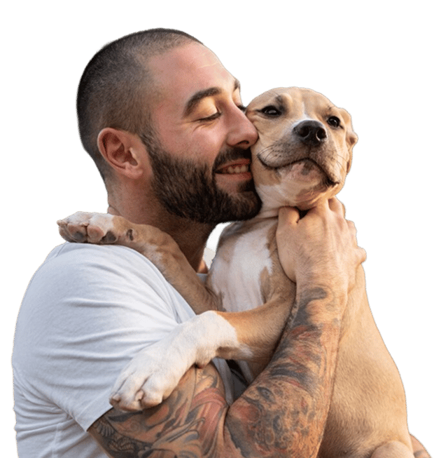 A man affectionately holding his puppy