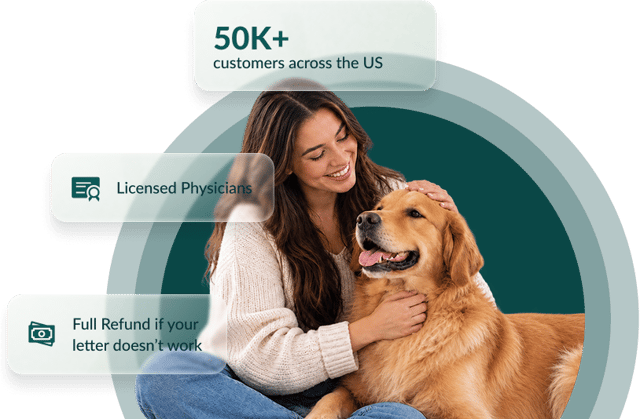 A man affectionately holding his emotional support dog