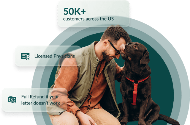 A man affectionately holding his emotional support dog